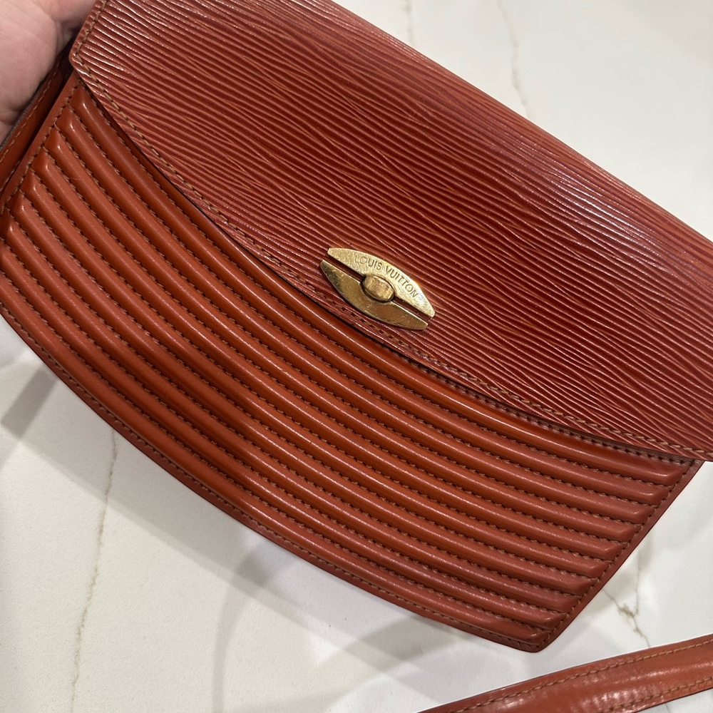 Louis Vuitton Red Textured Clutch